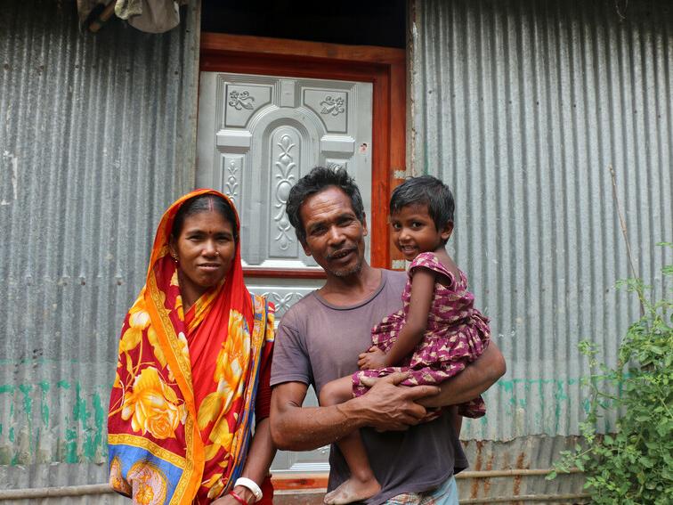 Tara and Budero with their youngest daughter Lipi who is part of Plan International’s sponsorship programme. 