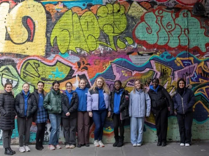 A group photo during a street art tour from the YAP residential.
