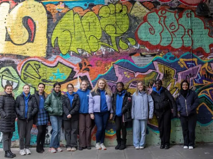A group photo during a street art tour from the YAP residential.