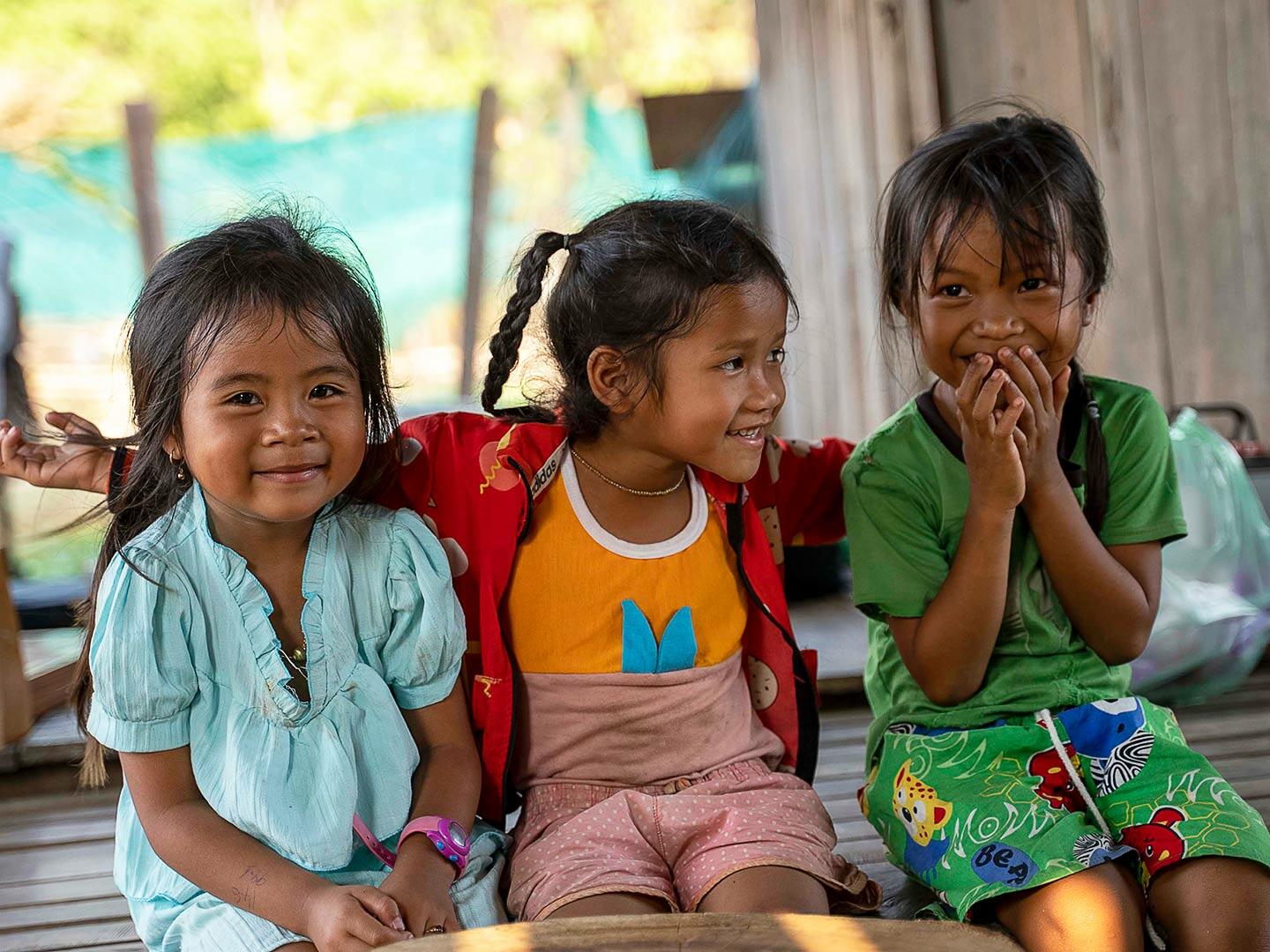 7-year-old Pheap (far right) at home with her two younger sisters