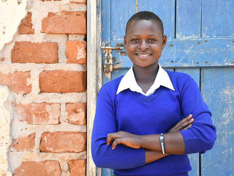 Hellen, 14, Tanzania, is happy be starting school for the first time.