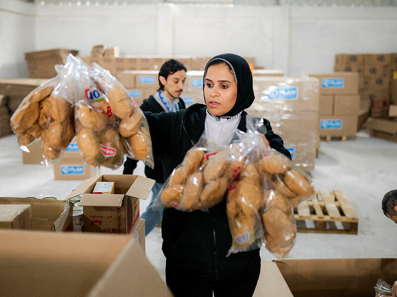 Plan Egypt staff prepare relief aid for transportation to Gaza  