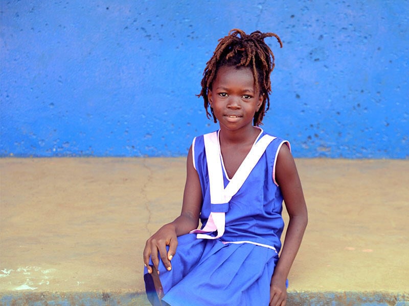 A girl looks at a camera