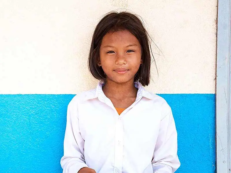 A girl looks at a camera