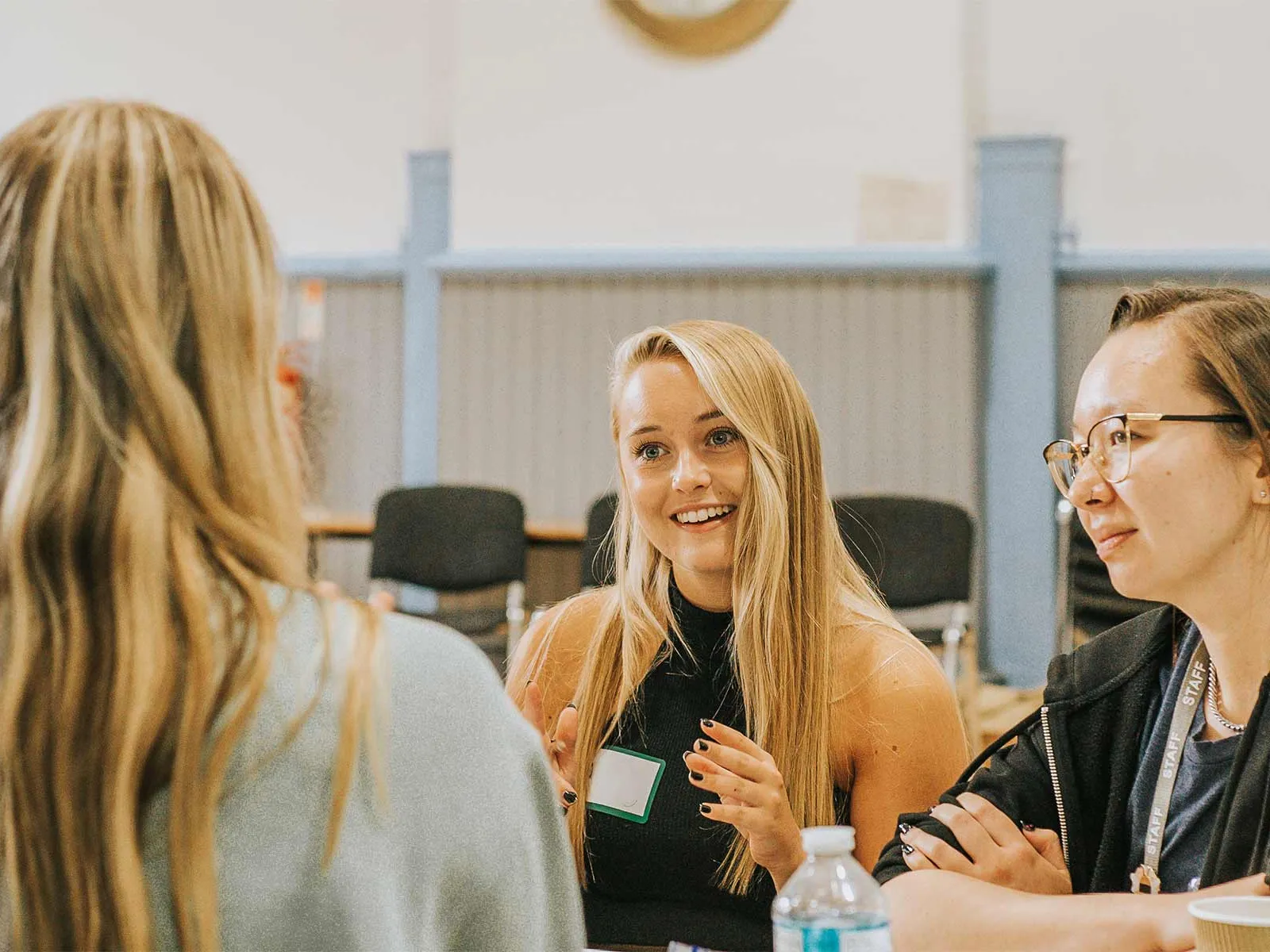 A group smile and talk during a workshop