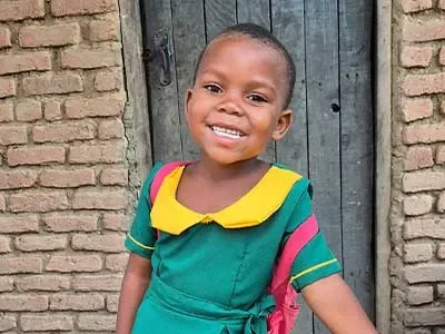 Asante, 5, Malawi in her school uniform
