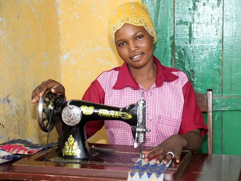 Roumana using sewing machine