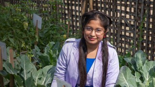 Akhimoni, maintaining her school garden in Bangladesh