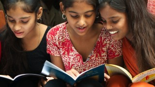 girls smile and read books